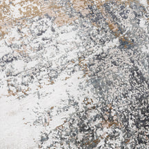 Close-up of the hand knotted wool and viscose texture with silver grey taupe and ivory abstract detailing