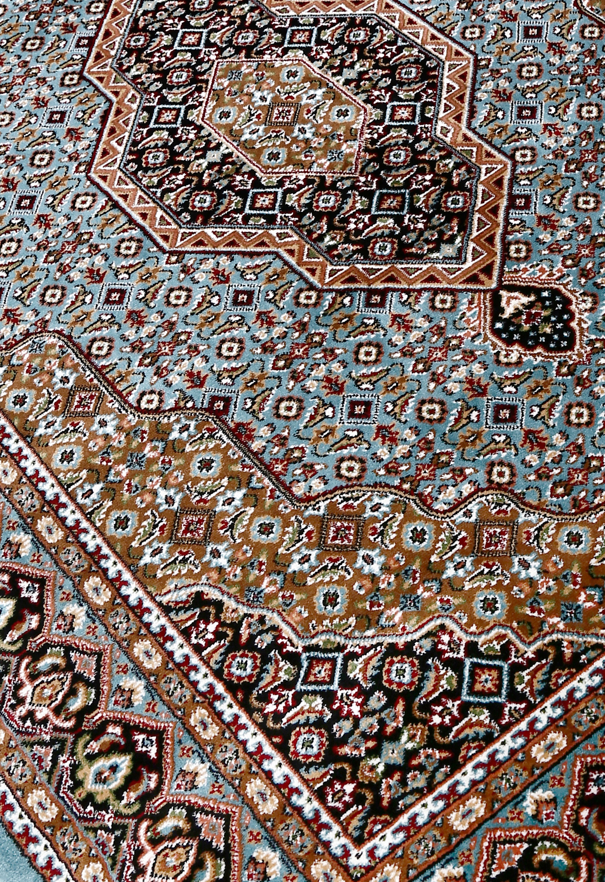 Close-up texture of Sky Blue Machine Woven Classic Art Silk Rug showing geometric motifs and smooth Art Silk surface