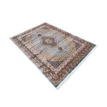 Side angle view of Sky Blue Geometric Medallion Machine Woven Classic Art Silk Rug by Khushi Living