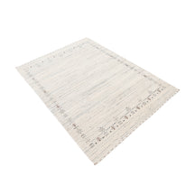 Side perspective of ivory grey Hand Woven Loom Lori wool rug highlighting natural wool texture and refined tribal border design