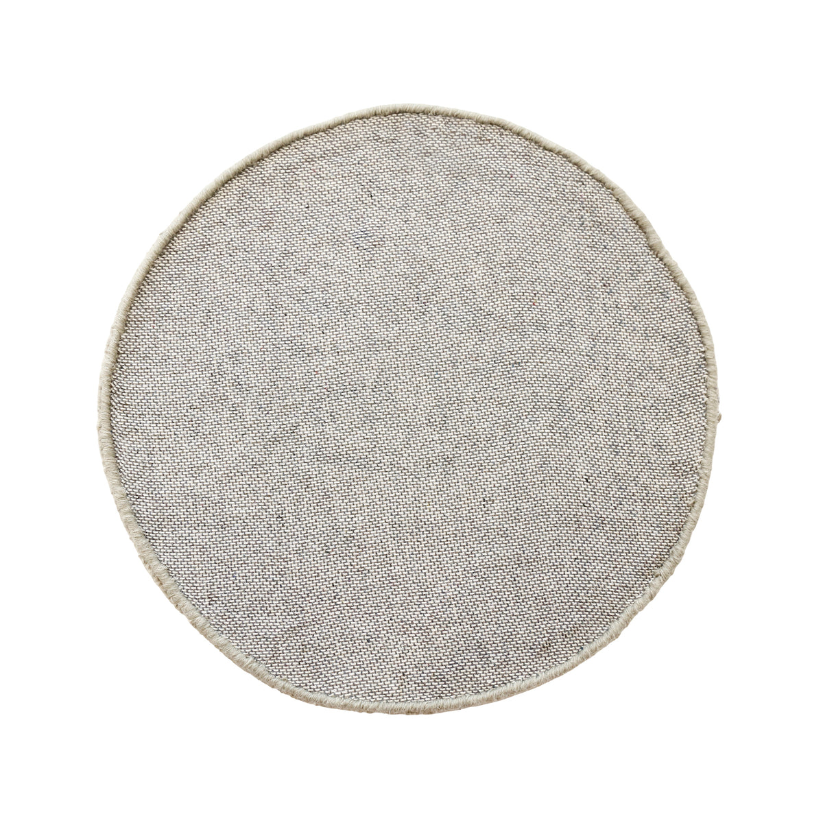 Side angle view of taupe smiley face wool kids rug showing its plush hand tufted pile, round shape and playful cartoon design.