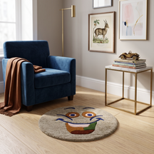 Taupe smiley face hand tufted wool kids rug styled in a playful children's bedroom with modern furniture and colourful decor.