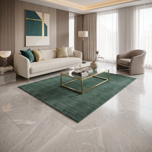 Teal Green Hand Woven Loom Lori wool rug styled in a modern living room with a cream sofa, glass coffee table and contemporary décor.