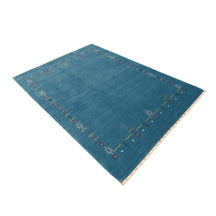 Side perspective of teal blue Hand Woven Loom Lori wool rug highlighting natural wool texture and refined tribal border design