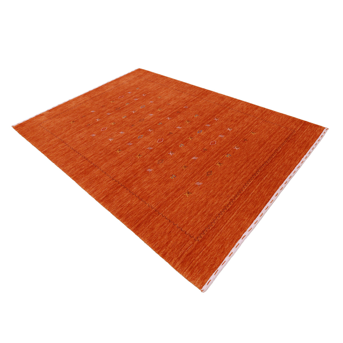 Side perspective of terracotta orange Hand Woven Loom Lori wool rug highlighting natural texture, scattered motifs and subtle border design
