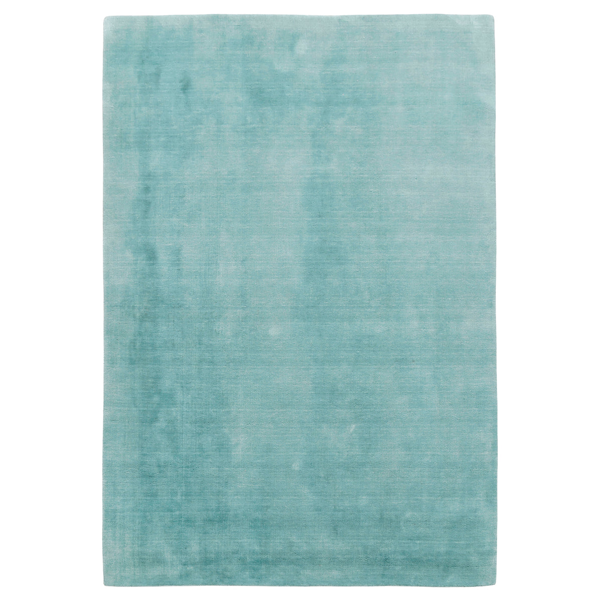 Full view of a turquoise hand woven Loom Lori wool rug featuring a clean plain design and subtle tonal variation.