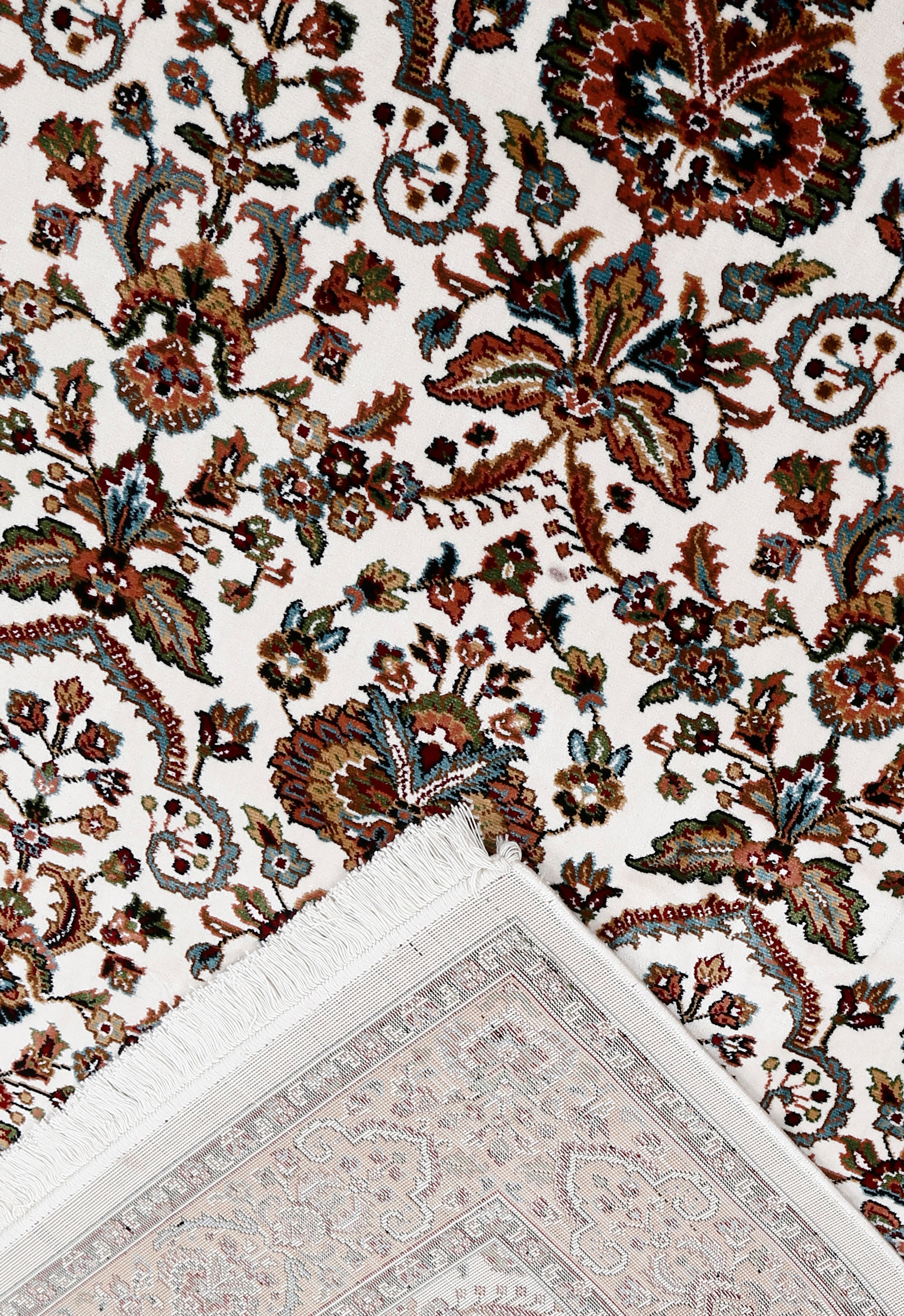 Corner and fringed edge detail of Ivory Floral Machine Woven Classic Art Silk Rug